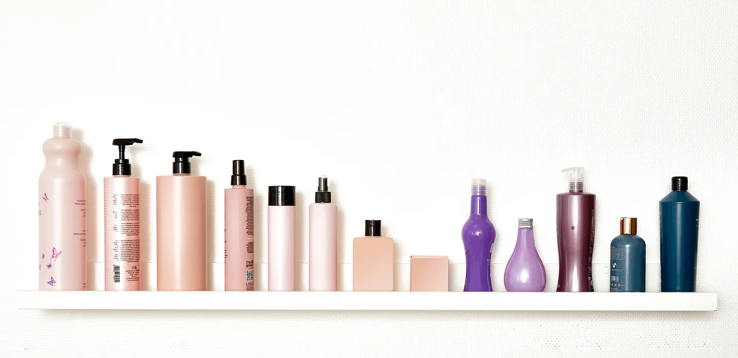 Hair products on a white shelf